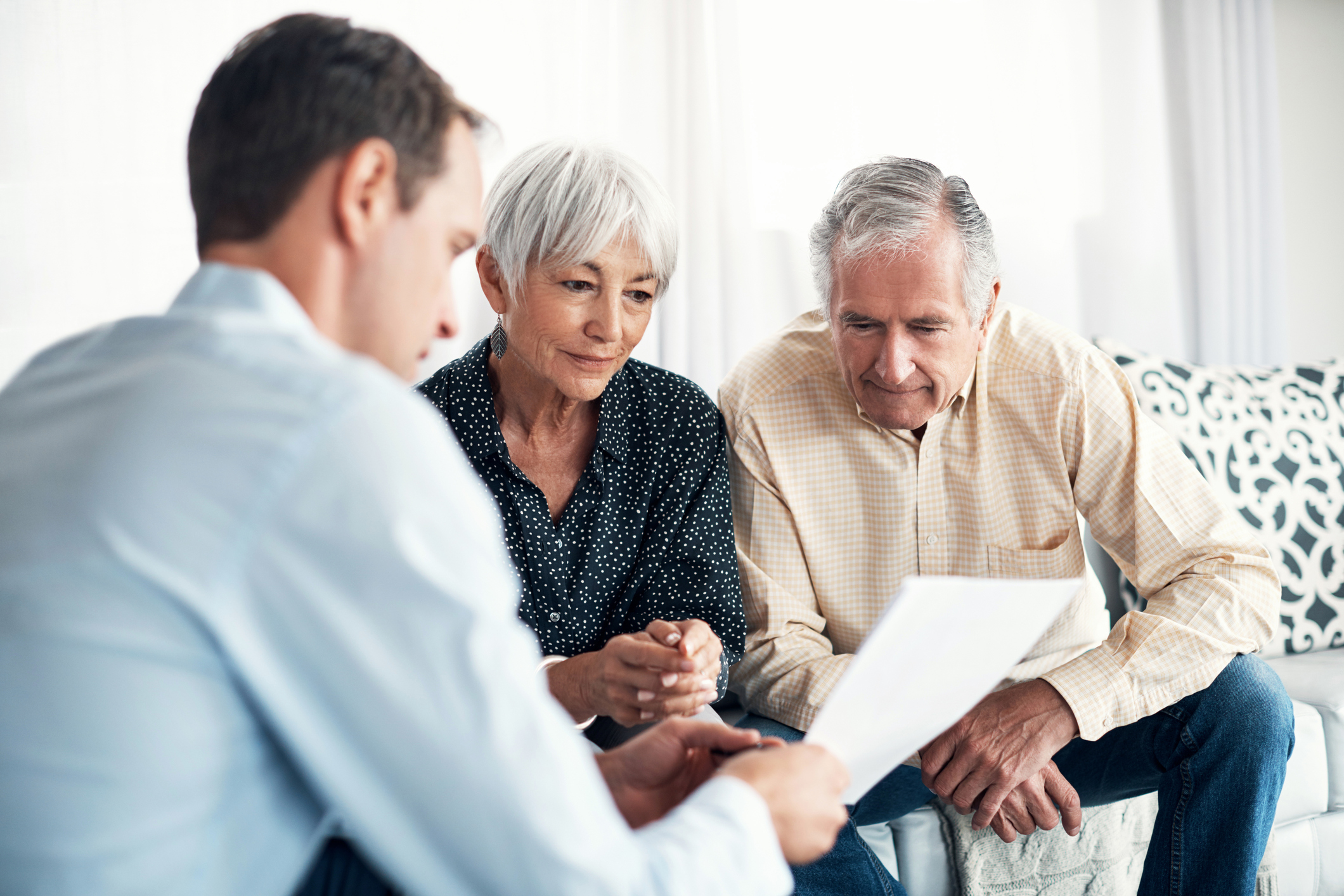 Shot of a senior couple getting advice from their financial consultant at home.